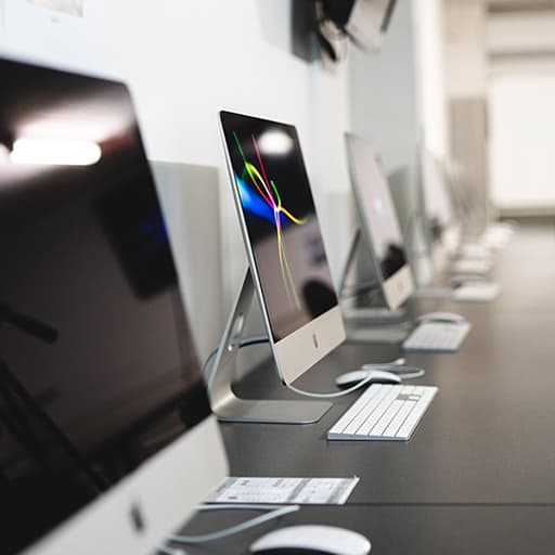 Photo of Apple computers in a row